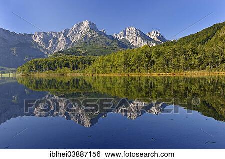 "Mountains reflected in Almsee Lake, Salzkammergut, Upper Austria, Austria, Europe" View Large Photo Image Stock Photograph - "Mountains reflected in Almsee Lake, Salzkammergut, Upper Austria, Austria, Europe". Fotosearch