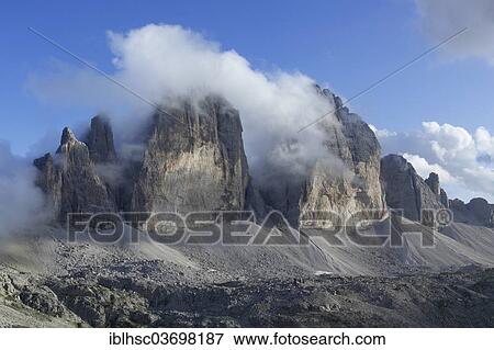 "Mountains Tre Cime di Lavaredo or Drei Zinnen, shrouded in clouds, Sexten Dolomites, Province of Bolzano-Bozen, Italy, Europe" View Large Photo Image Stock Photo - "Mountains Tre Cime di Lavaredo or Drei Zinnen, shrouded in clouds, Sexten Dolomites, Province of Bolzano-Bozen, Italy, Europe". Fotosearch