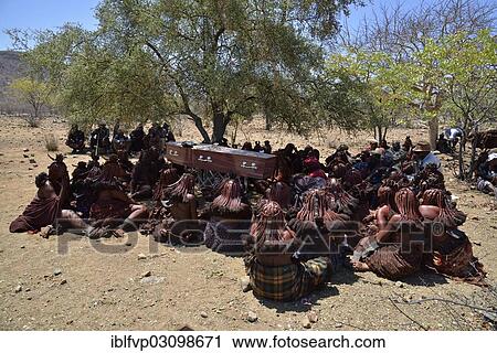 "Mourning Himba women sit around the coffin at a funeral, Omohanja, Kaokoland, Kunene, Namibia, Africa" View Large Photo Image Stock Image - "Mourning Himba women sit around the coffin at a funeral, Omohanja, Kaokoland, Kunene, Namibia, Africa". Fotosearch