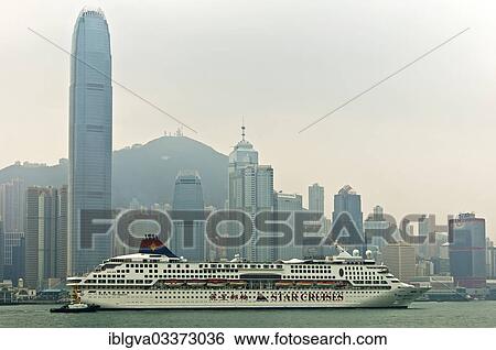Stock Photograph - "MS SuperStar Aquarius, cruise ship, in front of the Hong Kong skyline, Hong Kong, Hong Kong, China, People's Republic of China, Asia". Fotosearch
