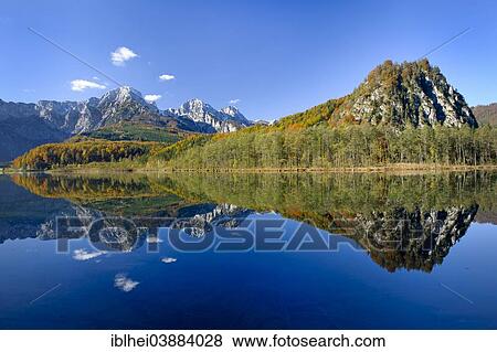 Stock Photo - "Mt Ameisstein, reflections in Almsee Lake, Totes Gebirge mountain range, Almtal Valley, Salzkammergut, Upper Austria, Austria, Europe". Fotosearch