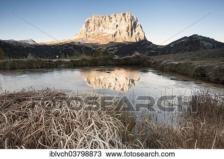Stock Image - "Mt Langkofel or Sasso Lungo from the Gardena Pass road, in autumn, Dolomites, South Tyrol, Alto Adige, Italy, Europe". Fotosearch