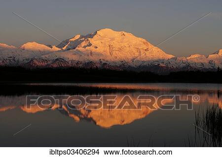 Picture - "Mt McKinley at sunset, with reflections in Reflection Pond, Denali National Park, Alaska, United States, North America". Fotosearch