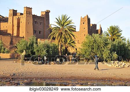 "Mud-brick building or Tighremts and date palm trees (Phoenix dactylifera) of the fortified city or ksar Ait Ben Haddou, High Atlas, Ait Ben Haddou, Souss-Massa-Draa region, Morocco, Africa" View Large Photo Image Stock Photo - "Mud-brick building or Tighremts and date palm trees (Phoenix dactylifera) of the fortified city or ksar Ait Ben Haddou, High Atlas, Ait Ben Haddou, Souss-Massa-Draa region, Morocco, Africa". Fotosearch