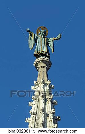 "Muenchner Kindl, statue by Anton Schmid, on top of the spire of the town hall, New Town Hall, Marienplatz, Munich, Upper Bavaria, Bavaria, Germany, Europe" View Large Photo Image Stock Photography - "Muenchner Kindl, statue by Anton Schmid, on top of the spire of the town hall, New Town Hall, Marienplatz, Munich, Upper Bavaria, Bavaria, Germany, Europe". Fotosearch