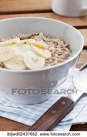 Muesli with yoghurt and banana View Large Photo Image Stock Image - Muesli with yoghurt and banana. Fotosearch