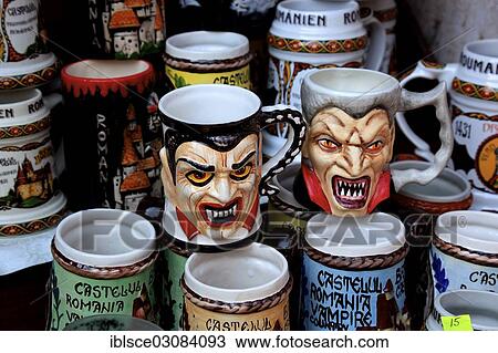 Stock Image - "Mugs with Dracula designs in a souvenir shop at Bran Castle, Bran, Brasov County, Transylvania, Romania, Europe". Fotosearch