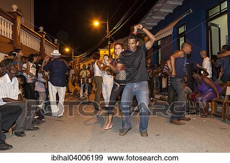 "Music and dancing in the street, in the evening, Baracoa, Cuba, North America" View Large Photo Image Stock Photo - "Music and dancing in the street, in the evening, Baracoa, Cuba, North America". Fotosearch