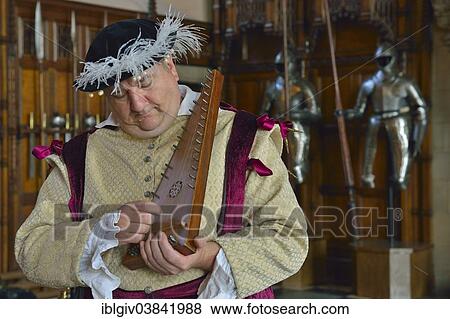 "Musician in period costume performing on a medieval psaltery, Edinburgh Castle, Edinburgh, Scotland, United Kingdom, Europe" View Large Photo Image Stock Photo - "Musician in period costume performing on a medieval psaltery, Edinburgh Castle, Edinburgh, Scotland, United Kingdom, Europe". Fotosearch