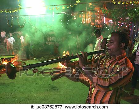 Stock Photo - "Musician playing a wind instrument, Nadhaswaram or Nagaswaram, at a Hindu Festival, Kovalam, Kerala, India, Asia". Fotosearch