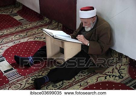 "Muslim man studying the Quran in the Et'hem Bey Mosque, Xhamia e Et'hem Beut, an Ottoman sacral building, Tirana, Albania, Europe" View Large Photo Image Stock Photography - "Muslim man studying the Quran in the Et'hem Bey Mosque, Xhamia e Et'hem Beut, an Ottoman sacral building, Tirana, Albania, Europe". Fotosearch