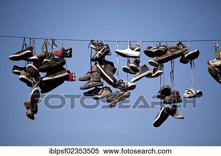 "Mysterious hanging shoes in the Flensburg Norderstrasse, Flensburg, Schleswig-Holstein, Germany, Europe" View Large Photo Image Stock Photography - "Mysterious hanging shoes in the Flensburg Norderstrasse, Flensburg, Schleswig-Holstein, Germany, Europe". Fotosearch
