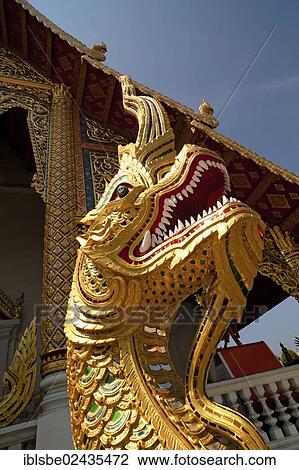 Stock Image - "Naga figure at the entrance of Viharn Luang, Wat Phra Singh, Chiang Mai, Northern Thailand, Thailand, Asia". Fotosearch