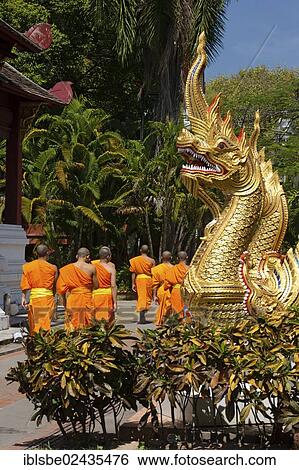 Stock Photograph - "Naga figure at Viharn Luang, monks, Wat Phra Singh, Chiang Mai, Northern Thailand, Thailand, Asia". Fotosearch