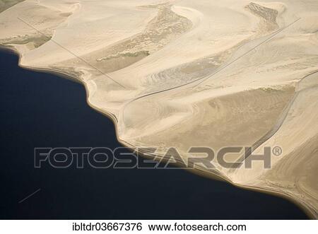 "Namib Desert and the Atlantic Ocean, aerial view, Namib-Skeleton Coast National Park, near Walvis Bay, Namibia, Africa" View Large Photo Image Stock Photograph - "Namib Desert and the Atlantic Ocean, aerial view, Namib-Skeleton Coast National Park, near Walvis Bay, Namibia, Africa". Fotosearch