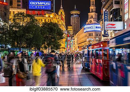 Stock Image - "Nanjing Road, pedestrian zone and busy shopping street at night, Shanghai, China, Asia". Fotosearch