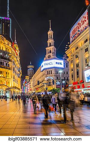 Stock Image - "Nanjing Road, pedestrian zone and busy shopping street at night, Shanghai, China, Asia". Fotosearch