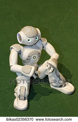 Stock Image - "NAO sitting on the soccer field, a humanoid robot from Aldebaran Robotics, IdeenPark 2012, technology and education summit conference for young people, Essen, Ruhr area, North Rhine-Westphalia, Germany, Europe". Fotosearch