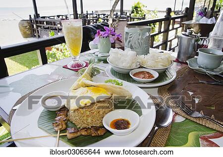 "Nasi Goreng, Indonesian fried rice, Indonesian cuisine, at a restaurant, Candi Dasa, Bali, Indonesia, Asia" View Large Photo Image Picture - "Nasi Goreng, Indonesian fried rice, Indonesian cuisine, at a restaurant, Candi Dasa, Bali, Indonesia, Asia". Fotosearch