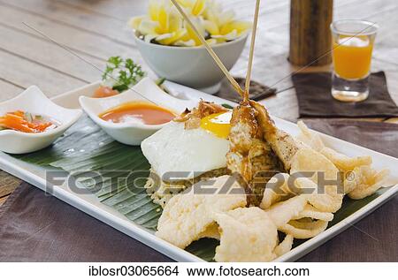 "Nasi Goreng, Indonesian fried rice, Indonesian cuisine, at a restaurant, Ubud, Bali, Indonesia, Asia" View Large Photo Image Picture - "Nasi Goreng, Indonesian fried rice, Indonesian cuisine, at a restaurant, Ubud, Bali, Indonesia, Asia". Fotosearch