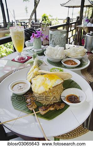 Stock Image - "Nasi Goreng, Indonesian fried rice, Indonesian cuisine, at a restaurant, Candi Dasa, Bali, Indonesia, Asia". Fotosearch