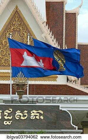Stock Image - "National flag and the flag of the Parliament outside the National Assembly Building, seat of the Parliament of Cambodia, Phnom Penh, Cambodia, Asia". Fotosearch