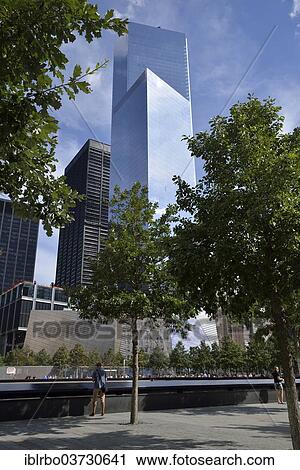 Stock Image - "National September 11 Memorial, Four World Trade Center at the rear, Manhattan, New York City, New York, United States, North America". Fotosearch