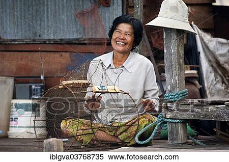 "Native woman with a fish trap, Tonle Sap Lake, near Siem Reap, Cambodia, Asia" View Large Photo Image Stock Photography - "Native woman with a fish trap, Tonle Sap Lake, near Siem Reap, Cambodia, Asia". Fotosearch