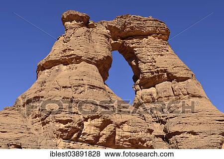 "Natural window in Tamezguida or La Cathedrale, Tadrart, Tassili n'Ajjer National Park, Unesco World Heritage Site, Sahara desert, Algeria, Africa" View Large Photo Image Stock Photo - "Natural window in Tamezguida or La Cathedrale, Tadrart, Tassili n'Ajjer National Park, Unesco World Heritage Site, Sahara desert, Algeria, Africa". Fotosearch