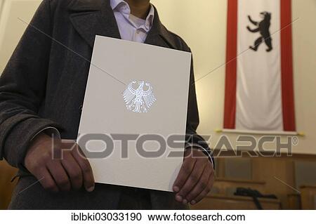 Stock Image - "Naturalisation ceremony in the town hall of Berlin-Neukoelln, in this venue, naturalisations take place every two weeks, Berlin-Neukolln, Berlin, Berlin, Germany, Europe". Fotosearch