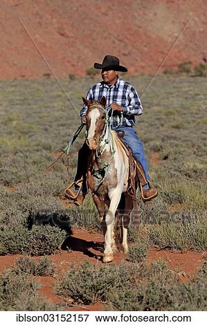 "Navajo cowboy riding on a Mustang, Utah, United States, North America" View Large Photo Image Stock Photo - "Navajo cowboy riding on a Mustang, Utah, United States, North America". Fotosearch
