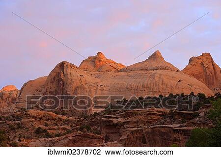 Stock Image - "Navajo Dome plateau at dawn, sunrise, Capitol Reef National Park, Utah, Southwestern USA, USA". Fotosearch