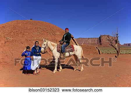 "Navajo Indian family with a horse, in front of a Navajo Hogan, a traditional residence, Monument Valley, Utah, United States, North America" View Large Photo Image Stock Image - "Navajo Indian family with a horse, in front of a Navajo Hogan, a traditional residence, Monument Valley, Utah, United States, North America". Fotosearch
