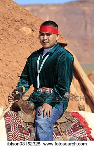 "Navajo Indian man riding a horse, in front of a Navajo Hogan, a traditional residence, Monument Valley, Utah, United States, North America" View Large Photo Image Stock Photography - "Navajo Indian man riding a horse, in front of a Navajo Hogan, a traditional residence, Monument Valley, Utah, United States, North America". Fotosearch