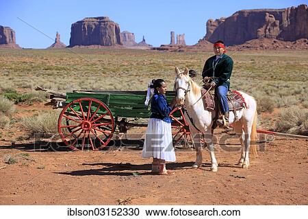 "Navajo Indians, man and woman with a horse in front of a carriage, Monument Valley, Utah, United States, North America" View Large Photo Image Stock Image - "Navajo Indians, man and woman with a horse in front of a carriage, Monument Valley, Utah, United States, North America". Fotosearch