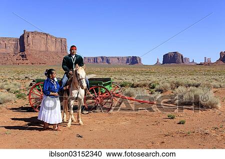 "Navajo Indians, man and woman with a horse in front of a carriage, Monument Valley, Utah, United States, North America" View Large Photo Image Stock Image - "Navajo Indians, man and woman with a horse in front of a carriage, Monument Valley, Utah, United States, North America". Fotosearch