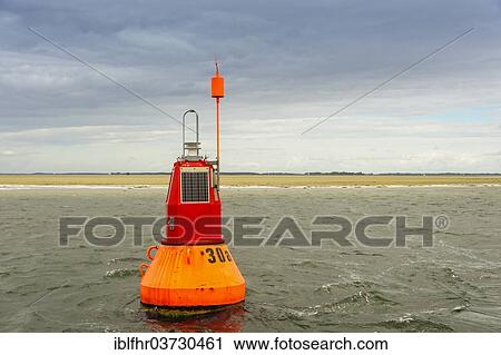 "Navigable water buoy in front of a sandbank, Baltic Sea, Barhoft, Mecklenburg-Western Pomerania, Germany, Europe" View Large Photo Image Stock Image - "Navigable water buoy in front of a sandbank, Baltic Sea, Barhoft, Mecklenburg-Western Pomerania, Germany, Europe". Fotosearch