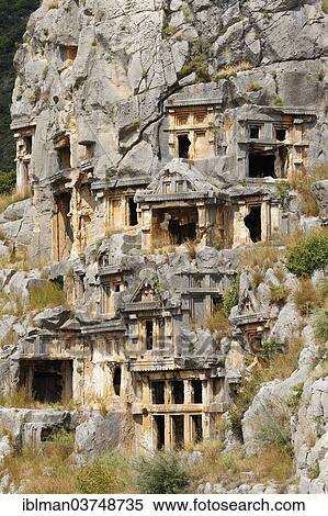"Necropolis or city of the dead, ancient Lycian rock tombs, Myra, Demre, Lycia, Province of Antalya, Turkey, Asia" View Large Photo Image Stock Photography - "Necropolis or city of the dead, ancient Lycian rock tombs, Myra, Demre, Lycia, Province of Antalya, Turkey, Asia". Fotosearch