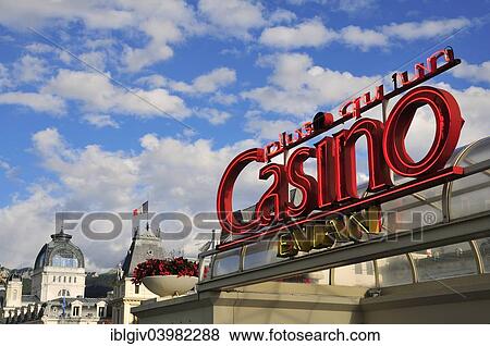 Stock Photo - "Neon sign of the Casino Evian in front of Town Hall and the Art Nouveau building of the Source Cachat, Evian-les-Bains, Haute-Savoie, Rhone-Alpes, France, Europe". Fotosearch