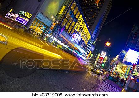 "Neon signs and a taxi with motion blur in Times Square, Manhattan, New York City, New York, United States, North America" View Large Photo Image Stock Photography - "Neon signs and a taxi with motion blur in Times Square, Manhattan, New York City, New York, United States, North America". Fotosearch
