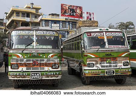 Stock Image - "Nepalese buses, bus station, building with advertising, Pokhara, Nepal, Asia". Fotosearch