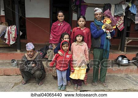 Stock Image - "Nepalese family in front of their house, Bandipur, Nepal, Asia". Fotosearch