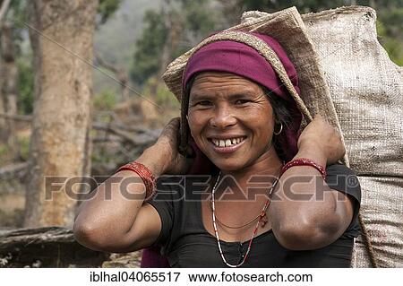 "Nepalese farmwoman carrying a full bag, near Bandipur, Nepal, Asia" View Large Photo Image Stock Photo - "Nepalese farmwoman carrying a full bag, near Bandipur, Nepal, Asia". Fotosearch