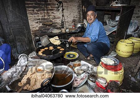 "Nepalese man producing fried food, Bhaktapur, Nepal, Asia" View Large Photo Image Stock Image - "Nepalese man producing fried food, Bhaktapur, Nepal, Asia". Fotosearch