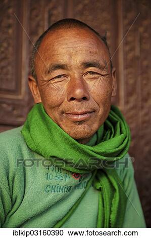 Stock Image - "Nepalese pilgrim, portrait, Boudhanath, Kathmandu, Kathmandu District, Bagmati Zone, Nepal, Asia". Fotosearch