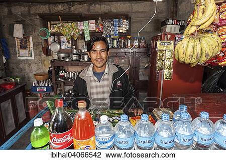 "Nepalese seller in a small food store in Sauraha, Nepal, Asia" View Large Photo Image Stock Image - "Nepalese seller in a small food store in Sauraha, Nepal, Asia". Fotosearch