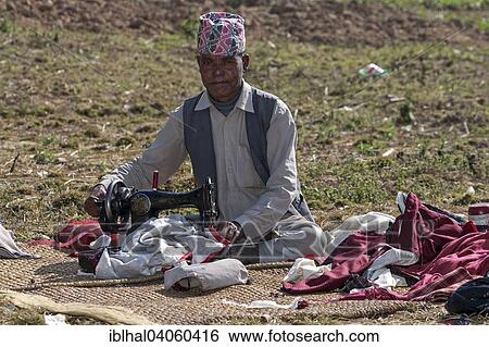 "Nepalese tailor with sewing machine in the country, at Nargakot, Nepal, Asia" View Large Photo Image Stock Photograph - "Nepalese tailor with sewing machine in the country, at Nargakot, Nepal, Asia". Fotosearch
