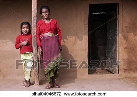 Stock Image - "Nepalese woman and a local girl, Bandipur, Nepal, Asia". Fotosearch