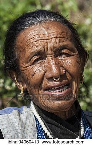 "Nepalese woman with earrings and nose piercing, portrait, with Nargakot, Nepal, Asia" View Large Photo Image Stock Image - "Nepalese woman with earrings and nose piercing, portrait, with Nargakot, Nepal, Asia". Fotosearch