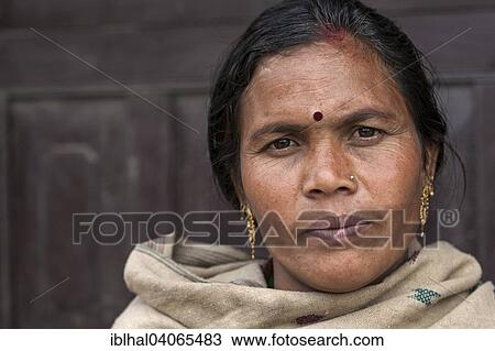 Stock Image - "Nepalese woman with earrings, portrait, Bandipur, Nepal, Asia". Fotosearch